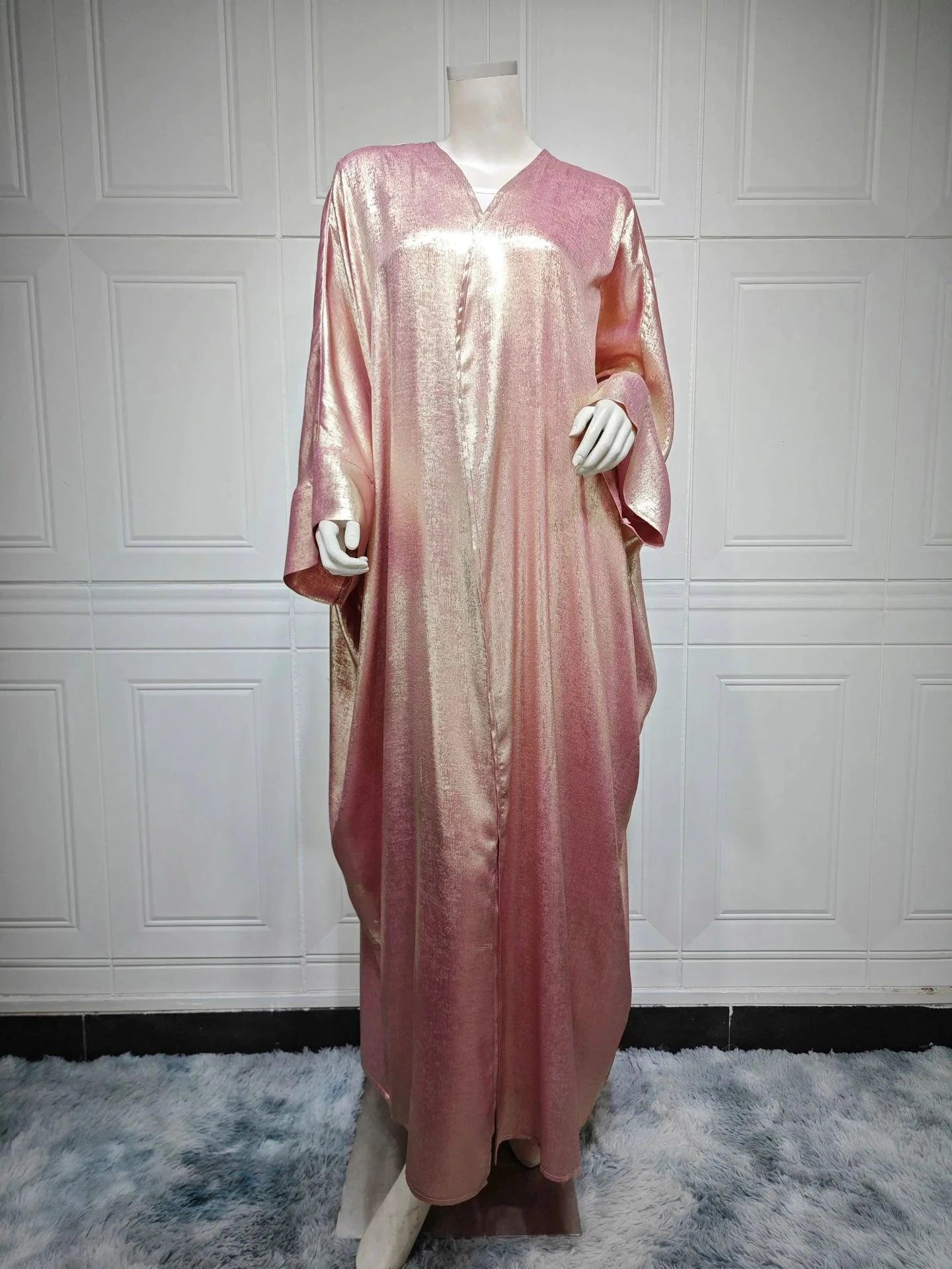 Mandotos Muslim robe abaya in black with intricate embroidery, flowing fabric, traditional modest dress for women.
