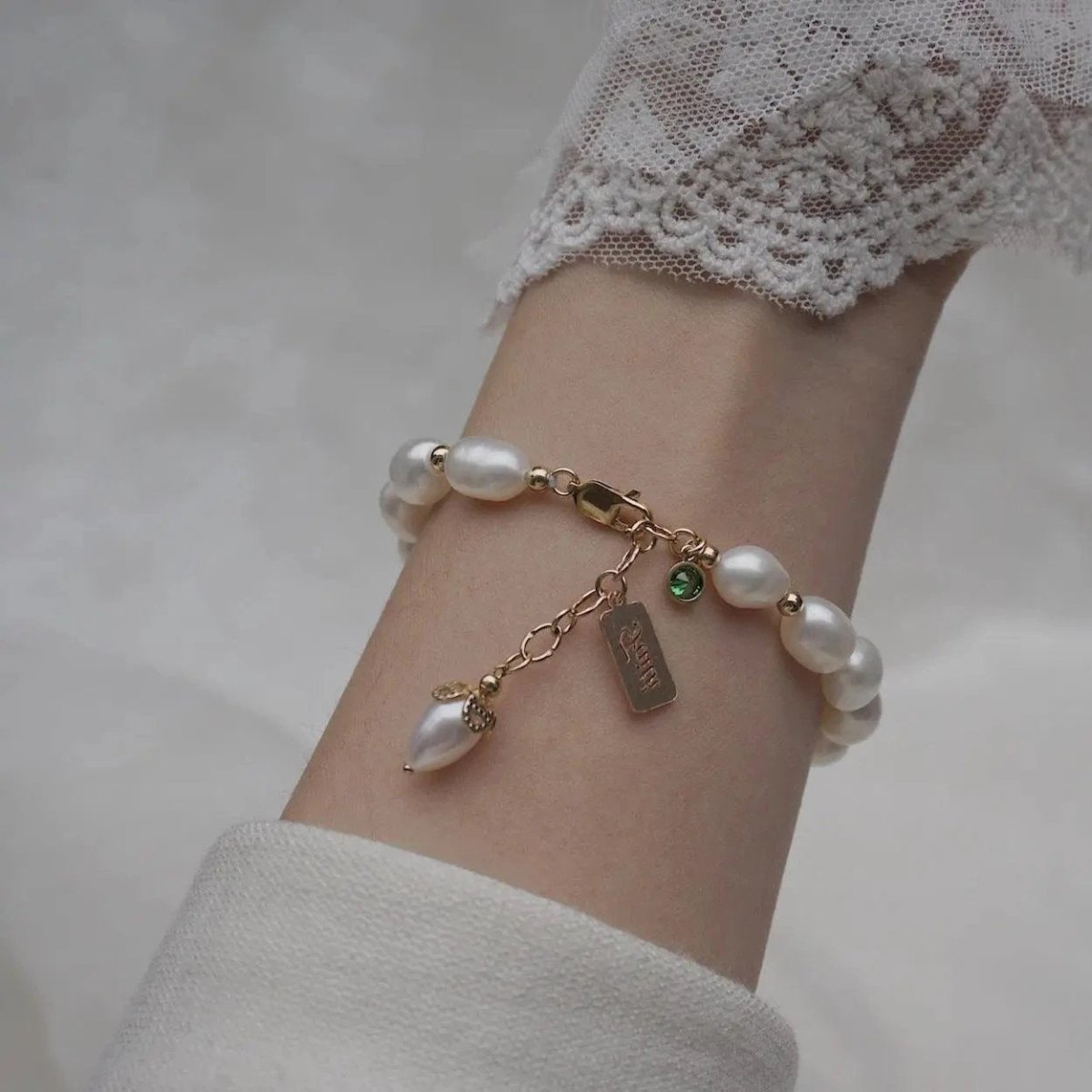 Luxury MANDOTOS natural zircon and pearl bracelet featuring elegant jewelry design with sparkling stones and smooth pearls.