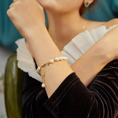 Elegant natural zircon and pearl bracelet by MANDOTOS, showcasing luxury jewelry with sparkling stones and lustrous pearls.