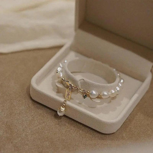 Luxury jewelry bracelet featuring natural zircon and pearl beads by MANDOTOS, elegant and sophisticated accessory.