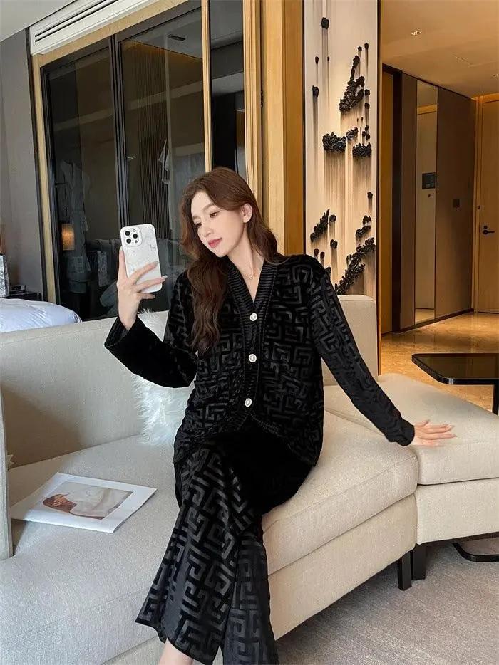 Gold velvet women's pajamas set by MANDOTOS, featuring a comfortable long-sleeve top and matching pants for cozy sleepwear.