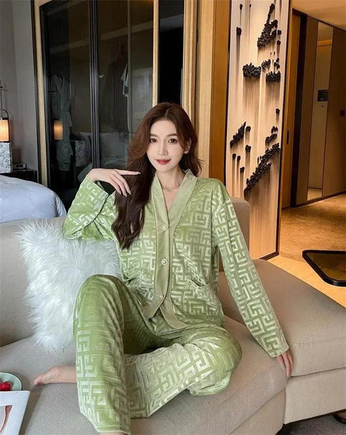 Gold velvet women's pajamas suit by MANDOTOS featuring a comfortable long-sleeve top and matching pants for relaxed sleepwear.
