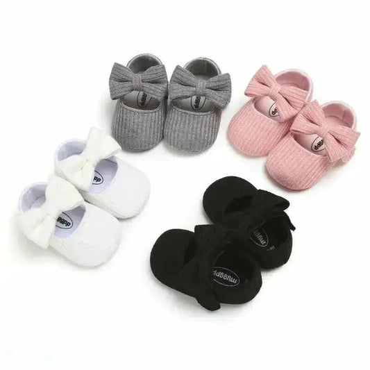 Soft newborn shoes by MANDOTOS, featuring cozy fabric and gentle design, perfect for delicate baby feet.