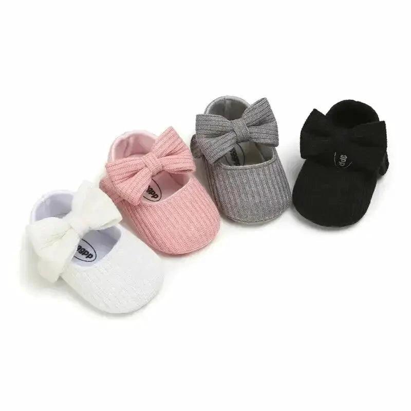Mandotos newborn soft shoes in pastel colors, featuring a cozy, flexible design for infant comfort and gentle fit.