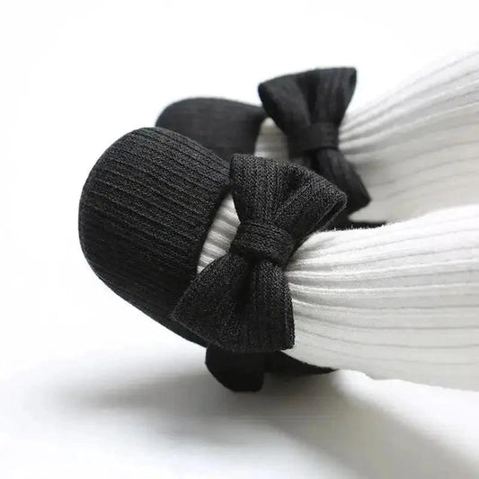 Soft newborn shoes by MANDOTOS featuring a cozy, flexible design with pastel colors and adorable details for delicate baby feet.
