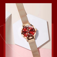 Mandotos OLEVS luxury ladies' watch with rose gold case, stainless steel mesh strap, love dial, and quartz movement.