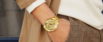 Mandotos OLEVS luxury gold men's skeleton chronograph wristwatch with stainless steel band, luminous dial, waterproof, quartz movement.