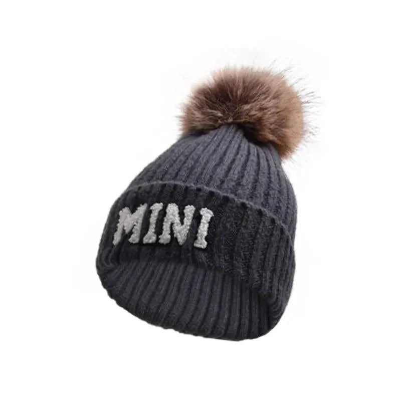 Set of three MANDOTOS parent-child matching beanie hats for mama, papa, and baby, perfect for winter warmth and family style.