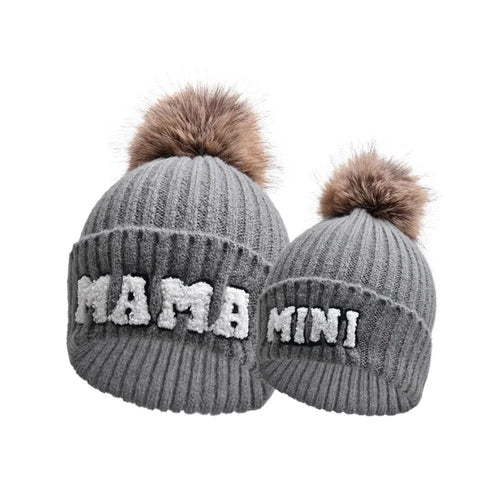 Set of three matching beanie hats for parents and baby from MANDOTOS, cozy winter knit caps in various colors.