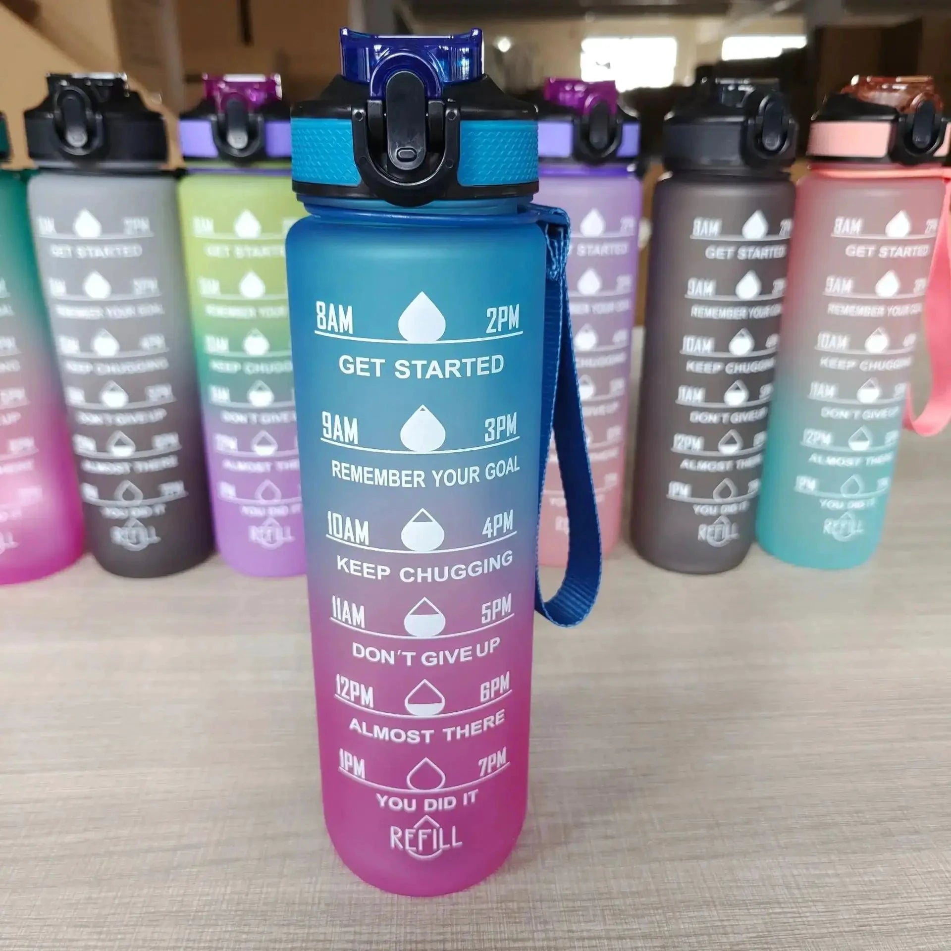 Mandotos PeakHydrate motivational water bottle with colorful design and ergonomic lid for easy drinking.