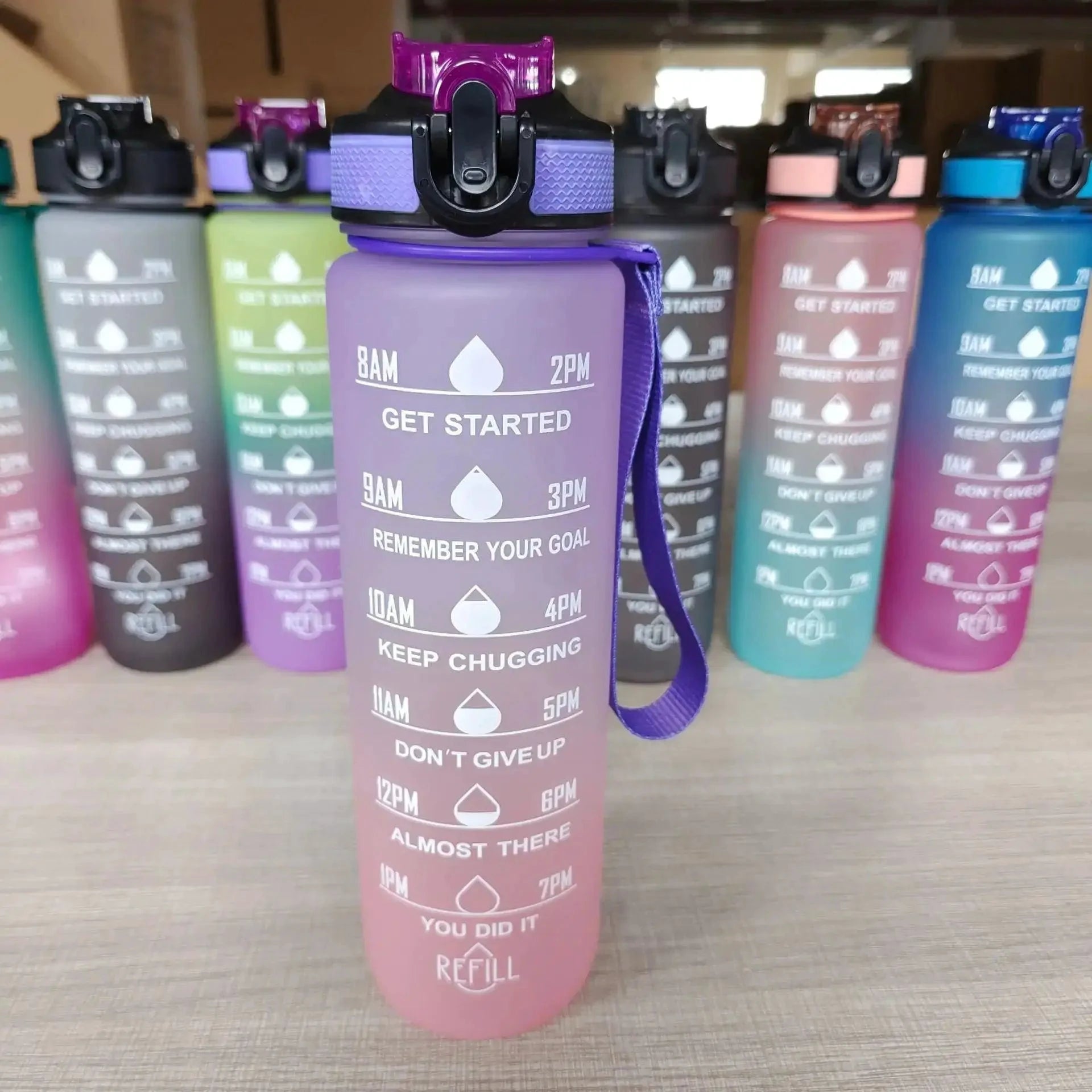 Mandotos PeakHydrate motivational water bottle with inspiring quote, blue and white design, durable plastic, and leak-proof lid.
