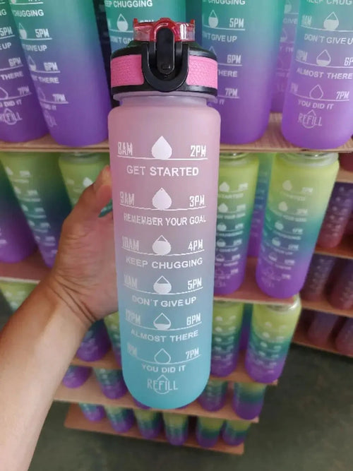 Mandotos PeakHydrate motivational water bottle with colorful design and flip-top lid, ideal for active hydration.