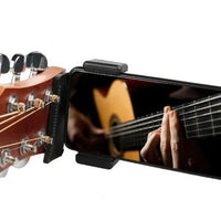Mandotos Phone Guitar Clip Stand holding a smartphone, compact and adjustable for convenient hands-free use.