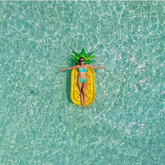 Mandotos Pineapple Paradise pool float with a colorful tropical pineapple design, perfect for summer pool days.