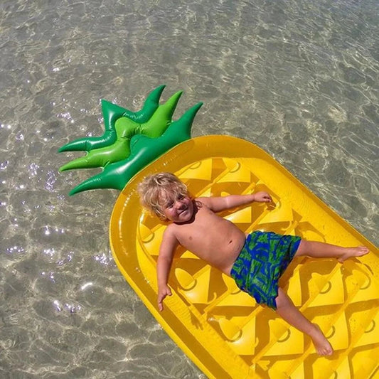 Colorful pineapple-shaped pool float by MANDOTOS with fun tropical design, perfect for summer relaxation and poolside fun.
