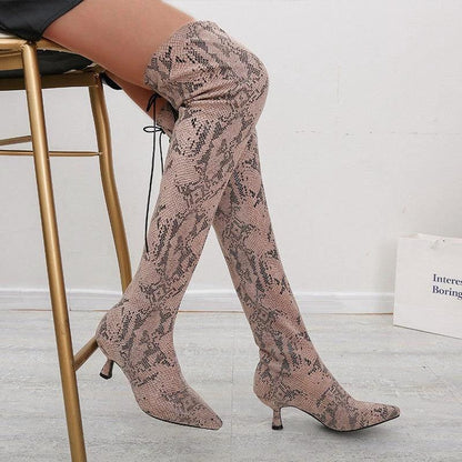 Mandotos pointed over-the-knee high fashion boots showcasing sleek design and tall silhouette in black leather.