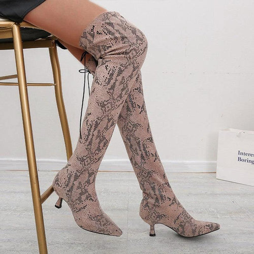 Mandotos pointed over-the-knee high fashion boots showcasing sleek design and tall silhouette in black leather.