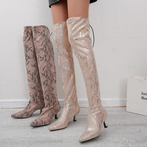 Mandotos pointed over-the-knee high fashion boots showcasing sleek design and tall, fitted silhouette in black leather.