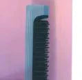 Portable MANDOTOS 2-in-1 hair styler with ceramic plates and curling barrel, compact design for versatile styling on the go.