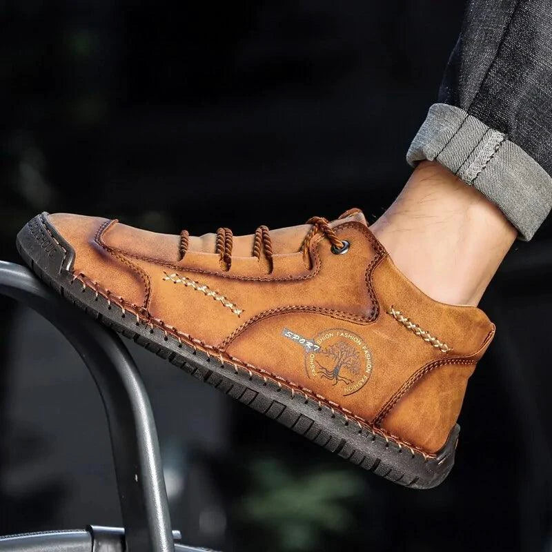 Mandotos premium microfiber leather boots showing sleek black design and detailed stitching on a neutral background.