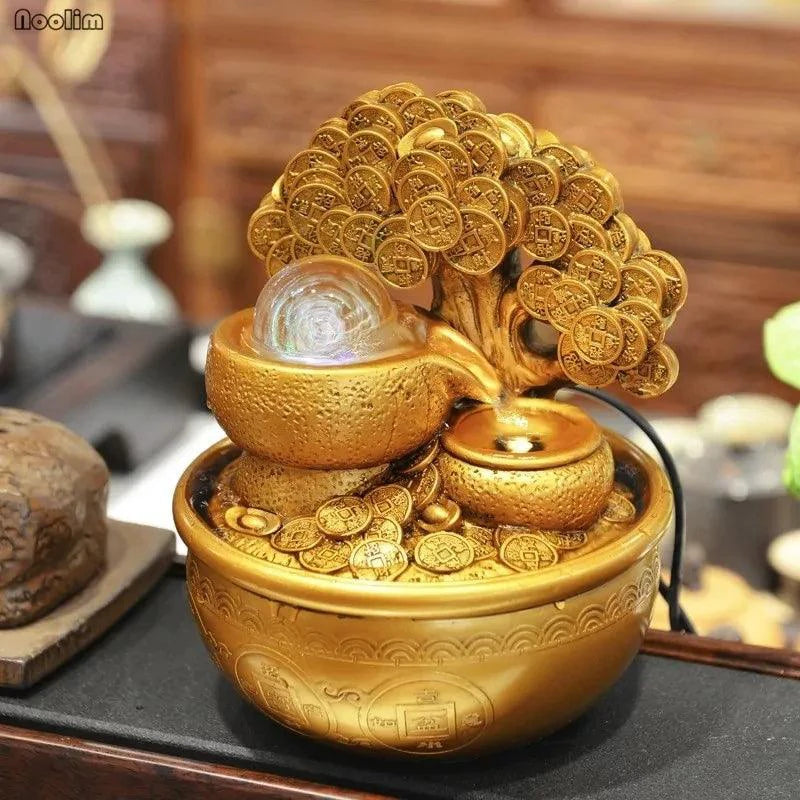 Mandotos Prosperity Gold Water Feature with golden finish and flowing water, decorative outdoor garden fountain.