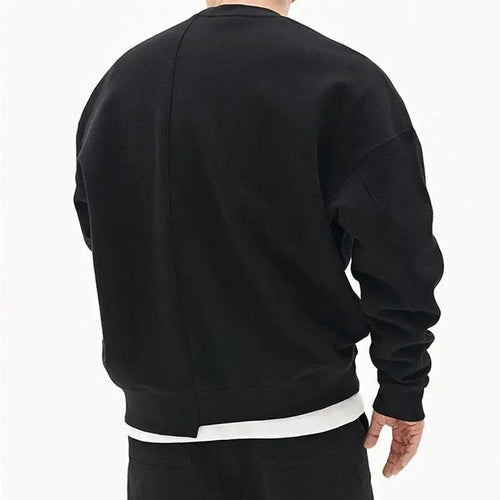 Loose men's pullover round neck sweater by MANDOTOS, showcasing a cozy fit and classic style in neutral fabric.