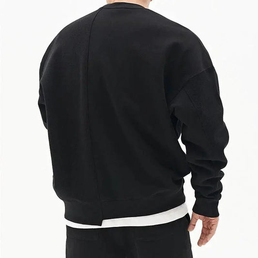 Loose men's pullover round neck sweater by MANDOTOS, showcasing a cozy fit and classic style in neutral fabric.
