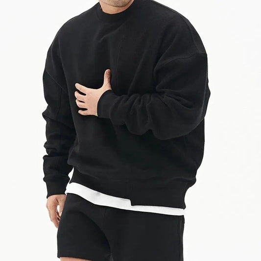 Loose men's round neck pullover sweater by MANDOTOS, showing a comfortable fit and soft knit fabric.