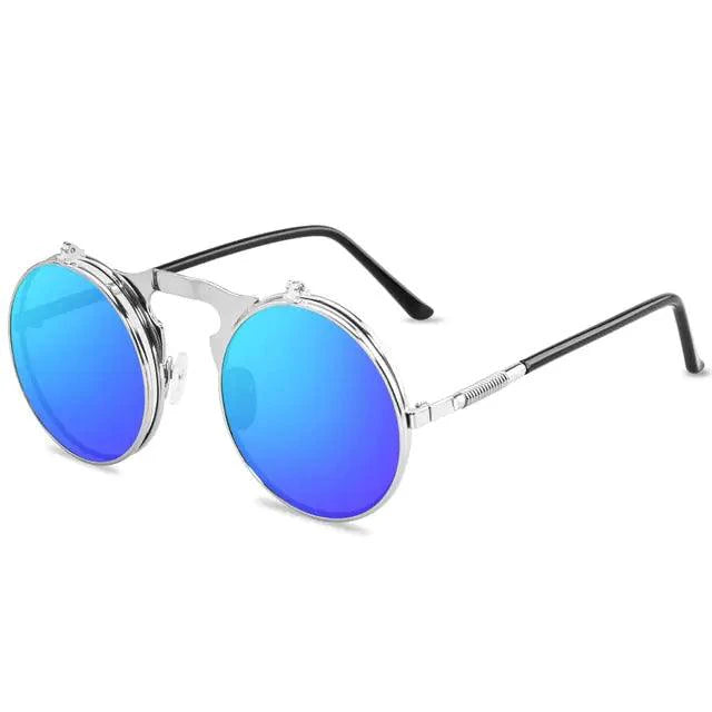 Retro flip steampunk sunglasses by MANDOTOS with brass-tone frames and tinted lenses, showcasing vintage-inspired eyewear style