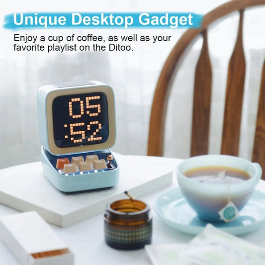 Mandotos retro pixel art Bluetooth speaker and alarm clock with colorful pixel design and digital display.