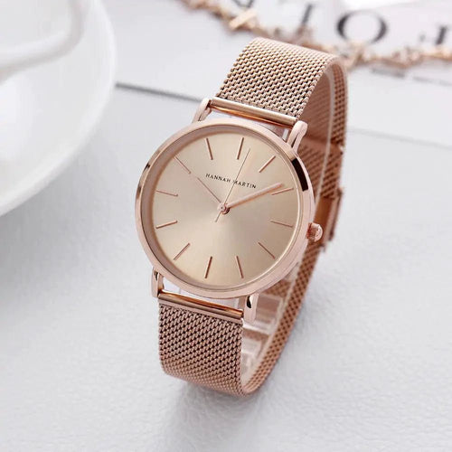 Rose gold stainless steel ladies' watch by MANDOTOS, featuring a sleek round face and elegant bracelet design.