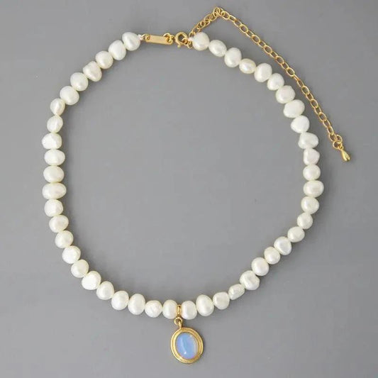 Mandotos round medal pearl necklace with irregular pearls, elegant jewelry piece showcasing a sophisticated design and natural pearl texture.