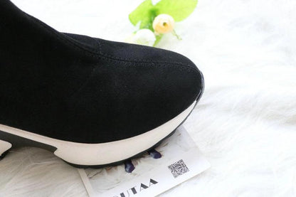 Mandotos round toe sports high heel over-the-knee boots shown in black with sleek design and chunky heel.