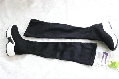 Mandotos round toe sports high heel over-the-knee boots in black with sleek design and chunky heel.