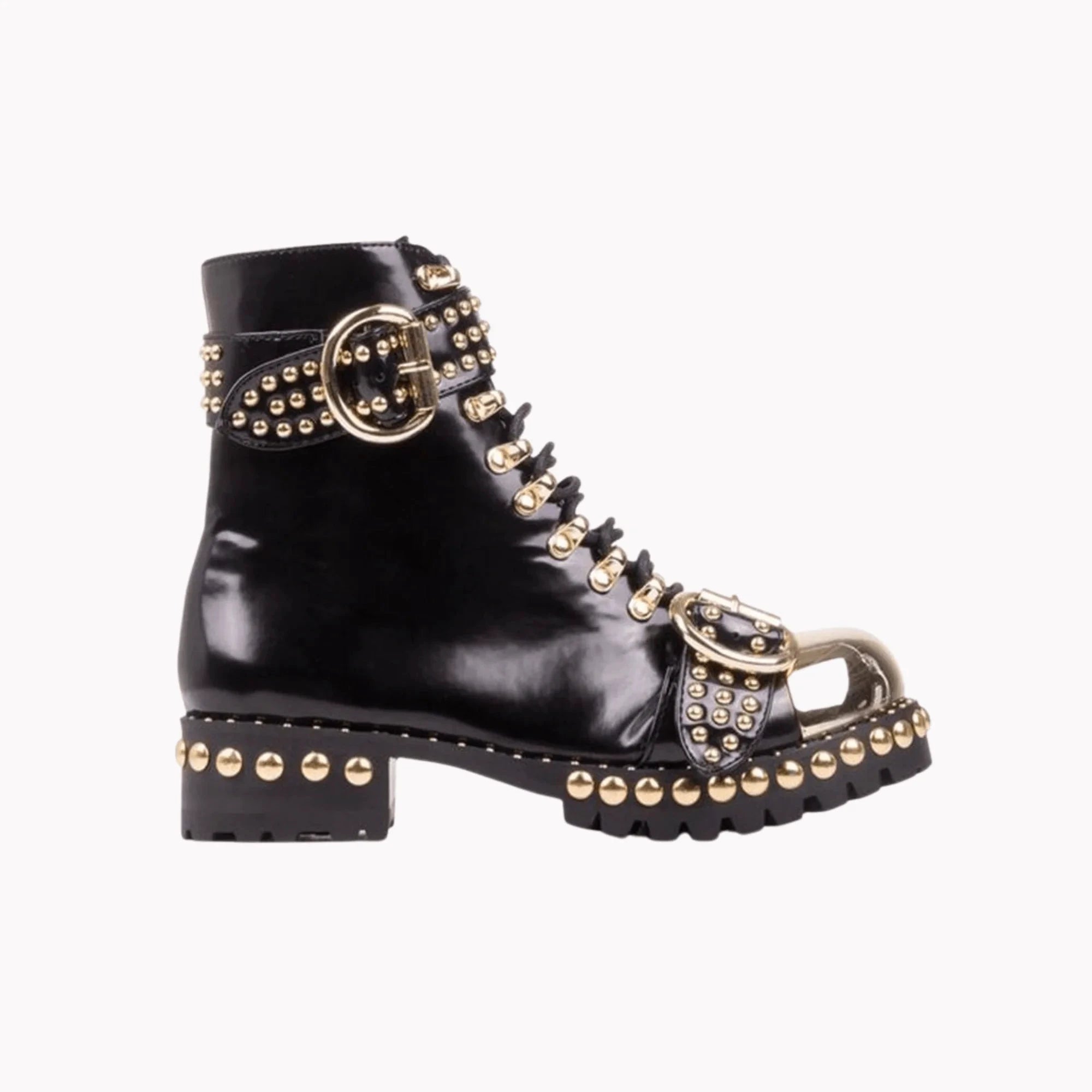 Mandotos rugged studded buckle boots featuring chunky heel, leather straps, and metal buckle for a bold, edgy look.