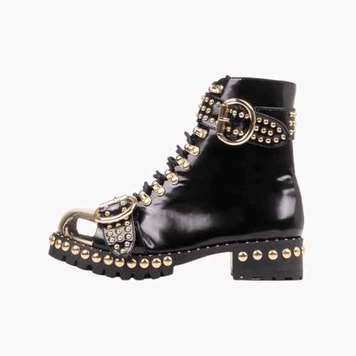 Mandotos rugged studded buckle boots with leather straps and metal buckles, showcasing a sturdy, edgy footwear style.