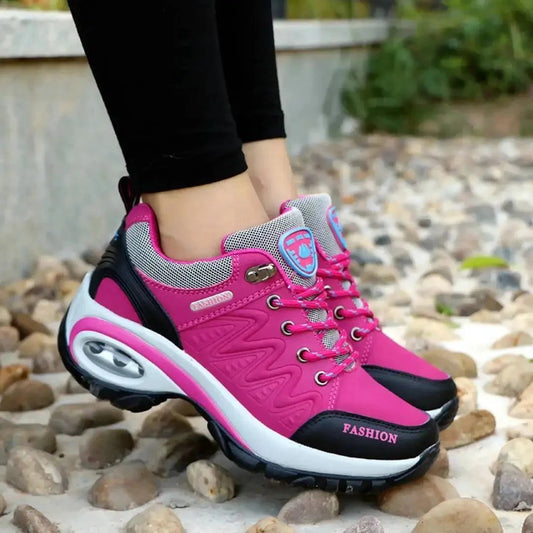 Mandotos running shoes with breathable mesh upper and cushioned soles, designed for comfortable athletic performance.