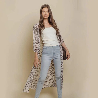 Mandotos Safari Chic Kimono featuring a lightweight, patterned fabric with wide sleeves and a relaxed fit.