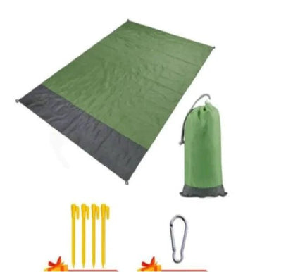 Mandotos sandproof portable beach mat spread out on sandy shore, lightweight and easy to carry for outdoor beach activities.
