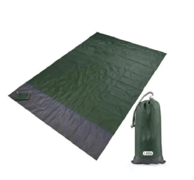 Mandotos sandproof portable beach mat spread on sandy shore, lightweight and foldable for easy beach outings.