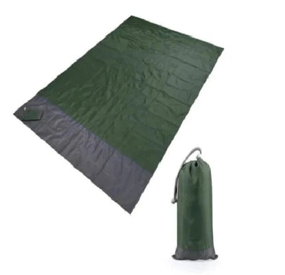 Mandotos sandproof portable beach mat spread out on sandy beach, lightweight and easy to carry for outdoor relaxation.