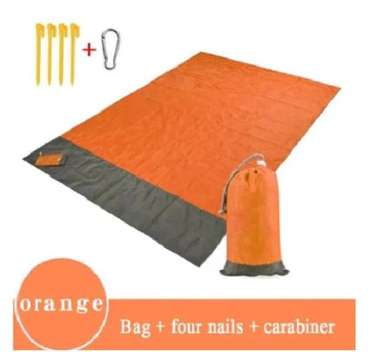 Mandotos sandproof portable beach mat spread on sandy shore, lightweight and durable for easy beach outings.