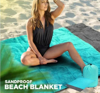 Mandotos sandproof portable beach mat spread on sandy shore, lightweight and foldable for easy beach trips.