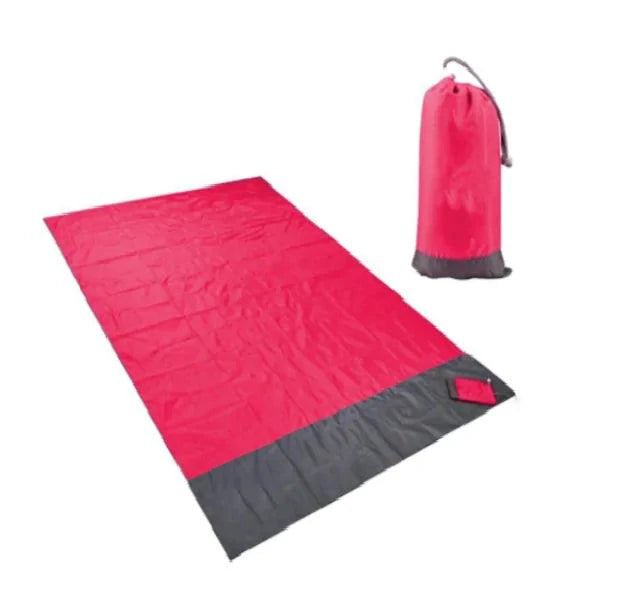 Mandotos sandproof portable beach mat spread on sandy shore, lightweight and foldable for easy beach outings.