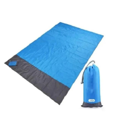 Mandotos sandproof portable beach mat spread out on sandy shore, lightweight and durable for outdoor beach outings.