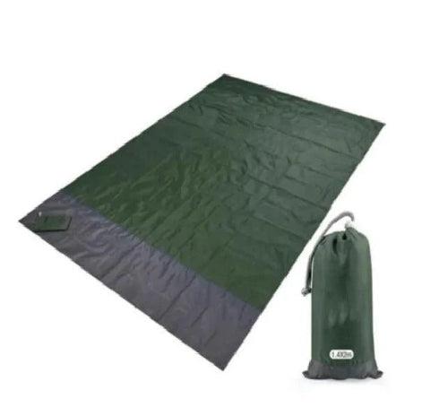 Mandotos sandproof portable beach mat laid out on sandy shore, lightweight and easy to carry for outdoor beach use.