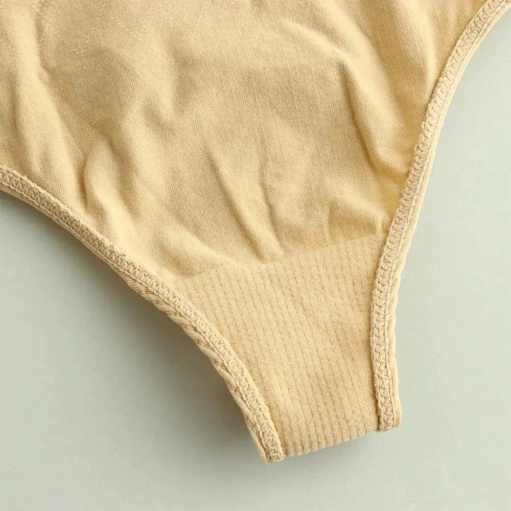 Mandotos seamless women's thong in neutral color, showing smooth, comfortable fit and minimal coverage for everyday wear.