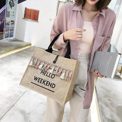 Mandotos Seaside Style Carryall bag with navy and white striped design, featuring sturdy handles and spacious interior for beach or casual use.