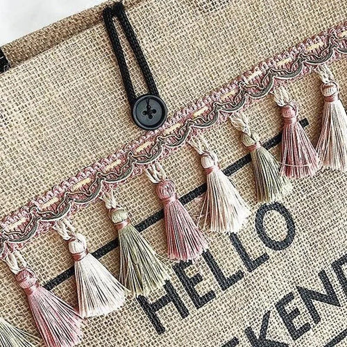 Mandotos seaside style carryall bag with woven design, featuring sturdy handles and spacious interior for beach or casual use.