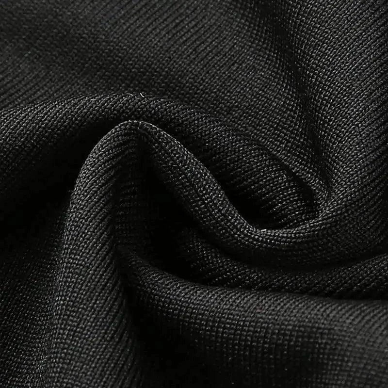 Black seductive leather lingerie bodysuit by MANDOTOS, featuring a form-fitting design and intricate detailing for an alluring look.
